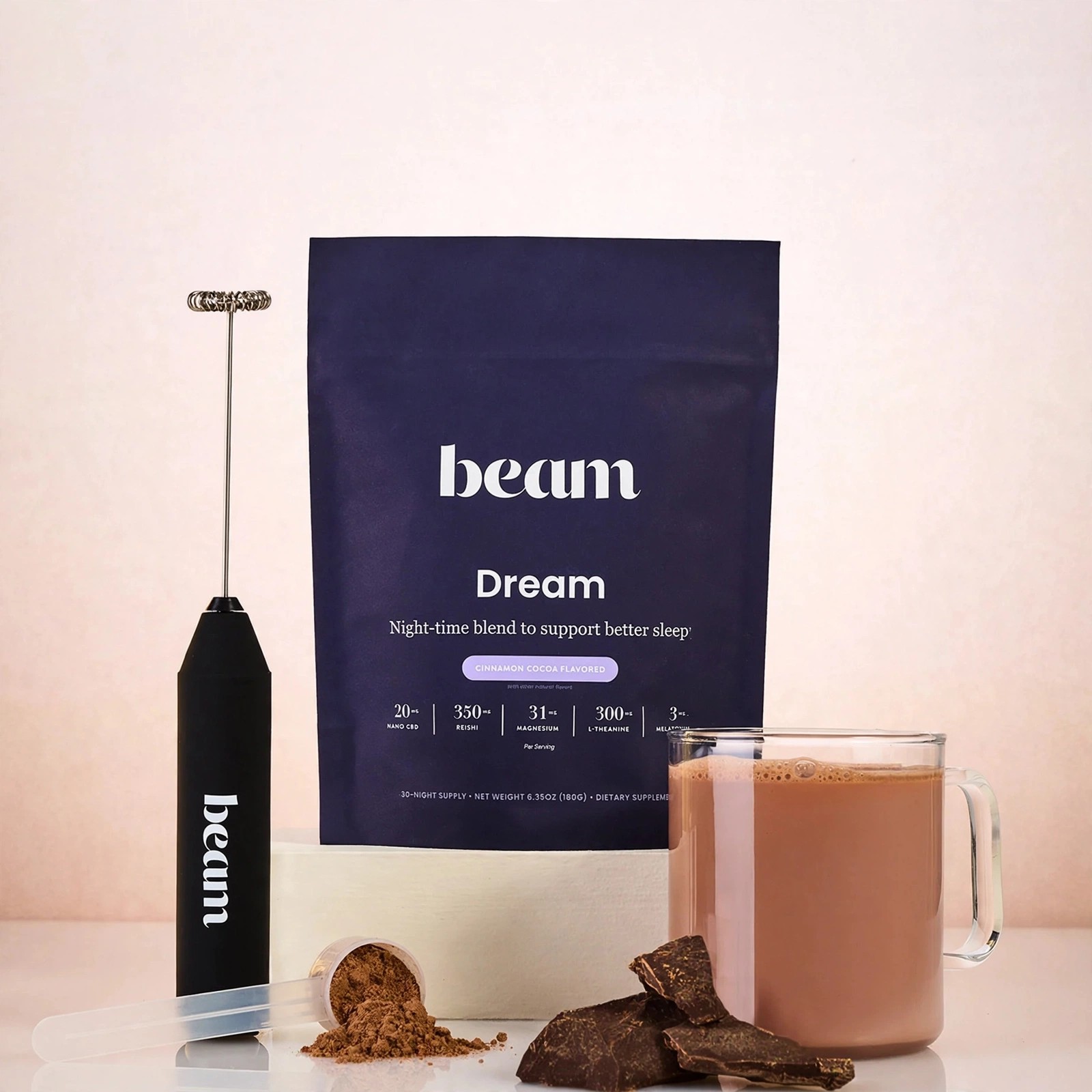 Chocolate Dream beverage in a glass mug next to the product bag.