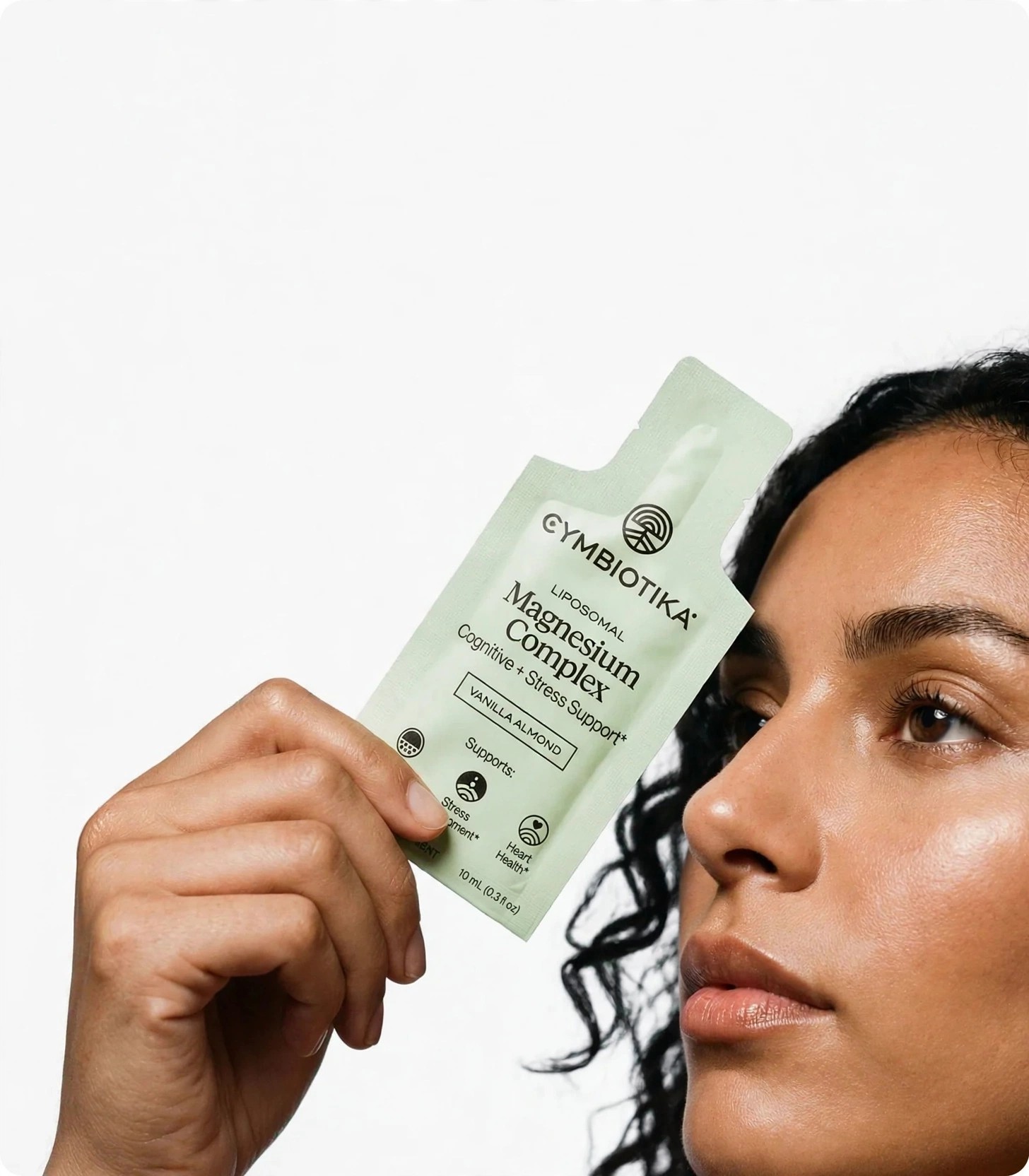 Model poses with a liposomal supplement pouch against white.