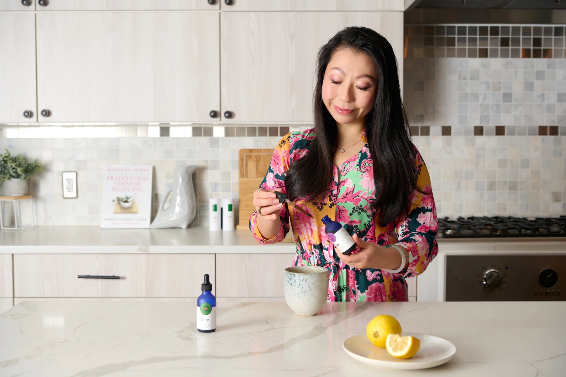 Lulu Ge uses a dropper over a ceramic mug at home.