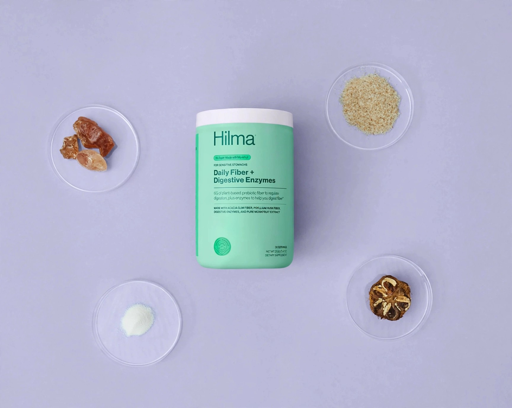 Hilma fiber powder styled flatlay with natural components around it.