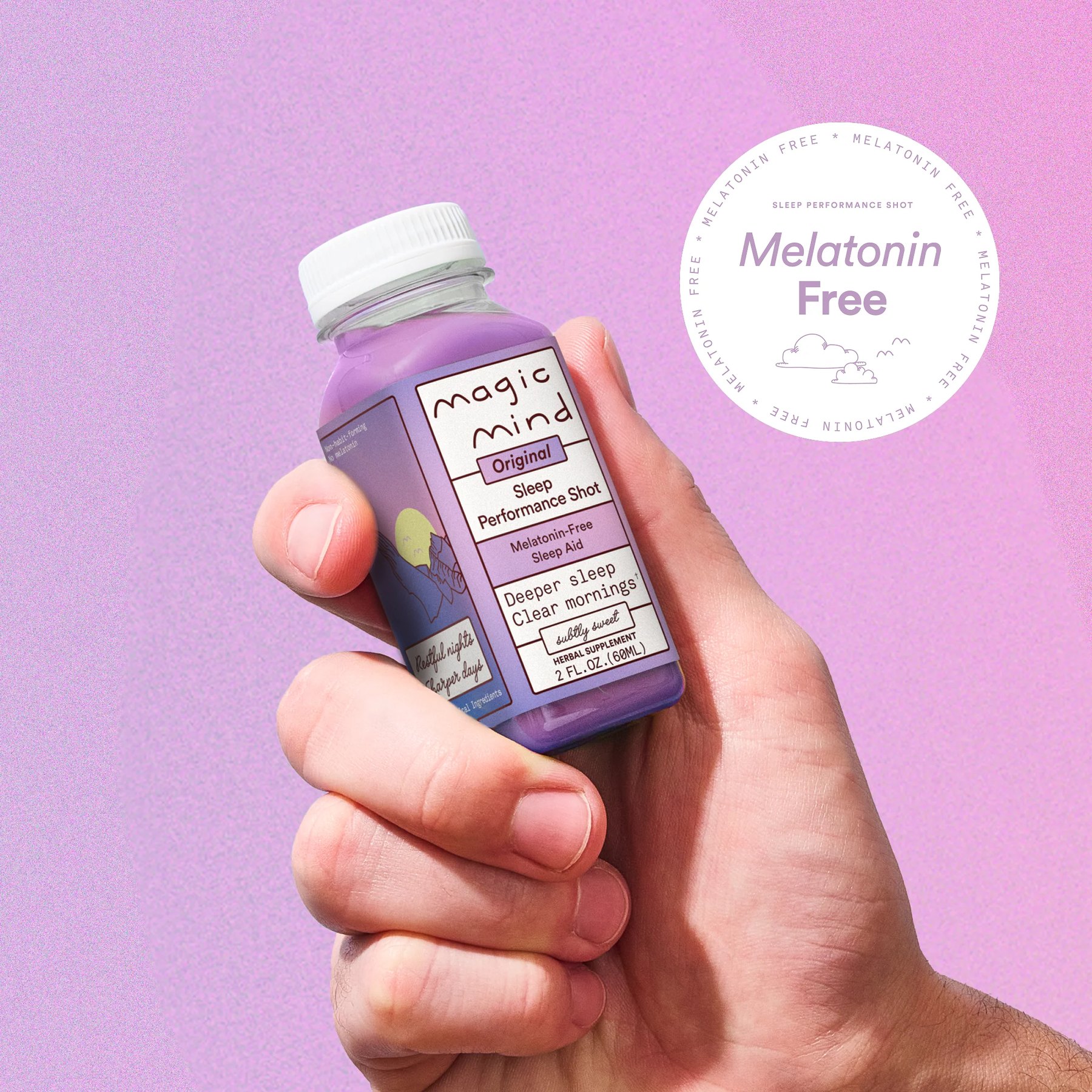 A Magic Mind Sleep bottle held in a hand closeup.