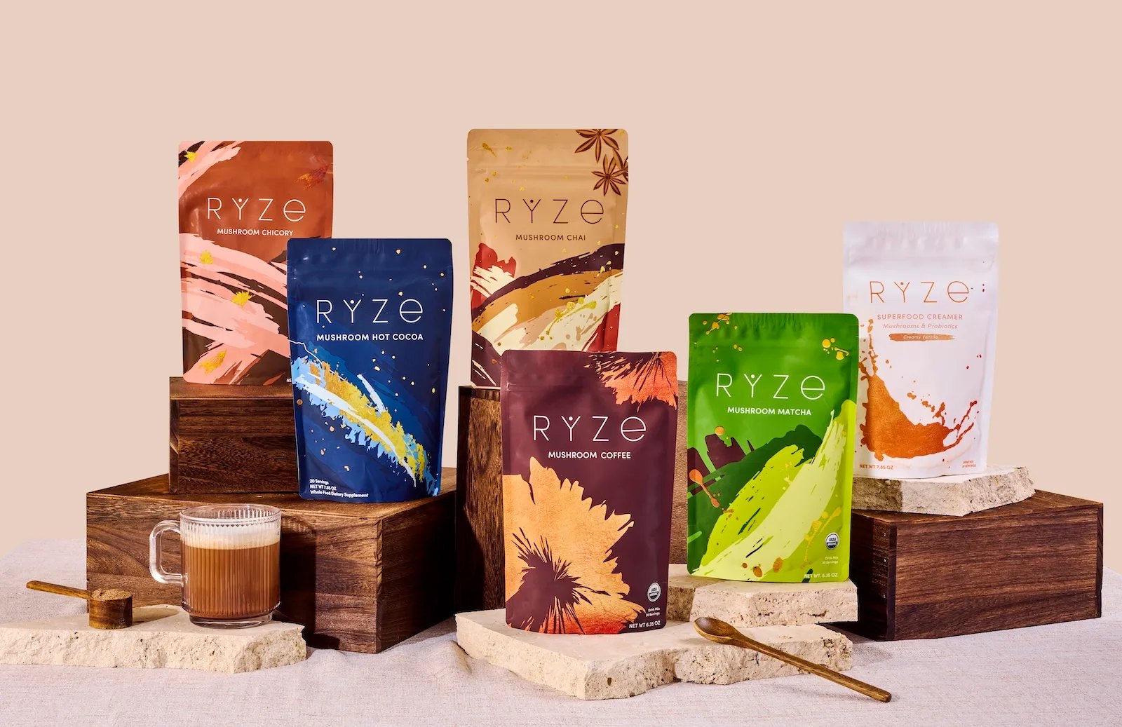 Assorted colorful RYZE bags styled on wooden risers.